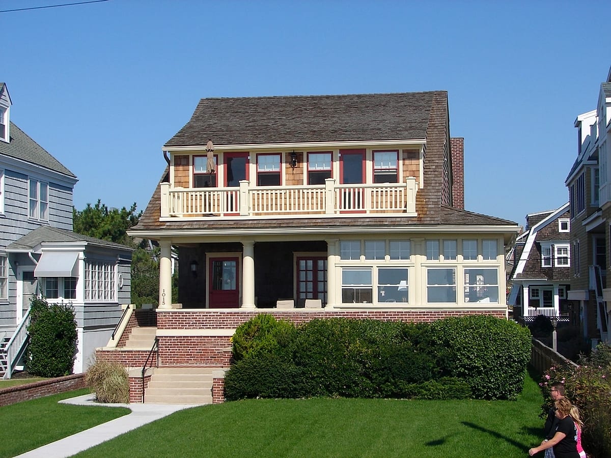 Porches, siding & trim kept tight — representative imagery, not a Guardian job