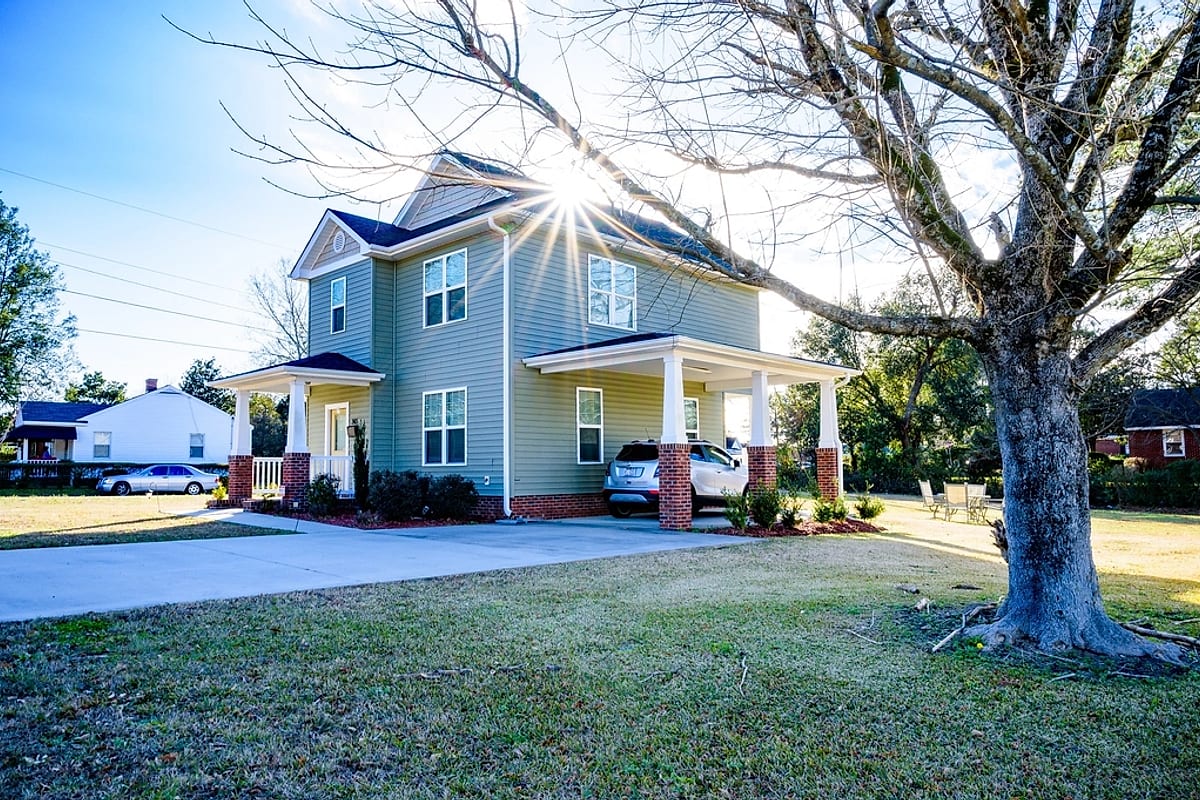 A two-story sided home on a frosty morning — representative backdrop